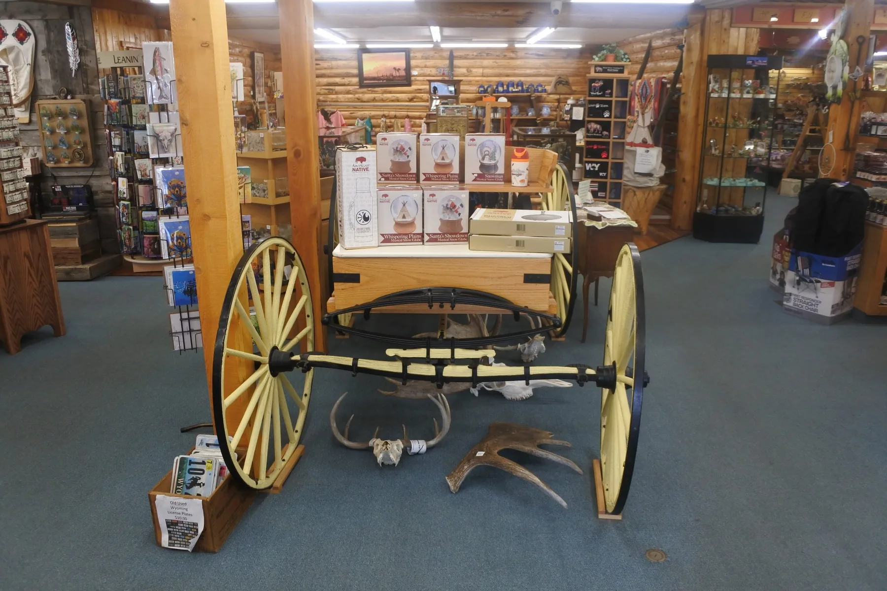 Interior display with a wagon, shelves, and gifts inside Wind River Trading Company