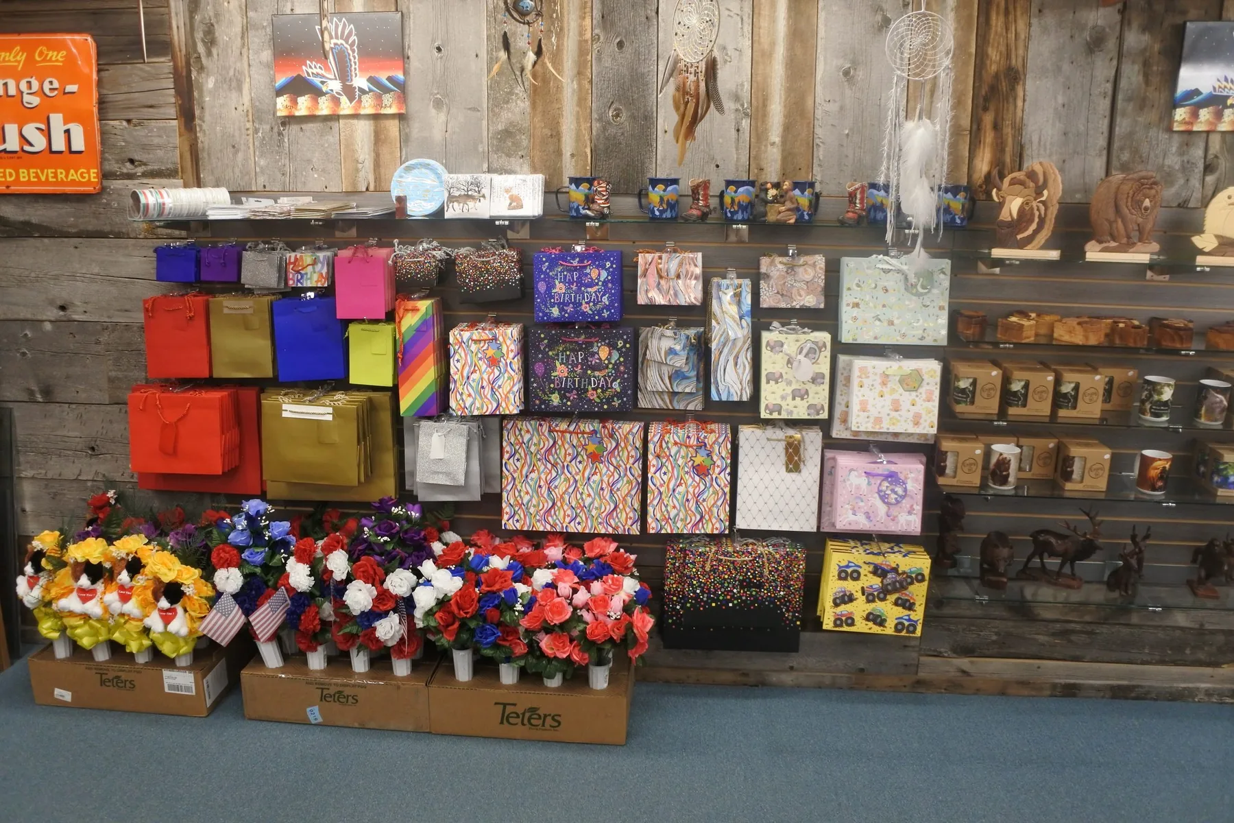 Gift bags, mugs, and small goods on display at Wind River Trading Company