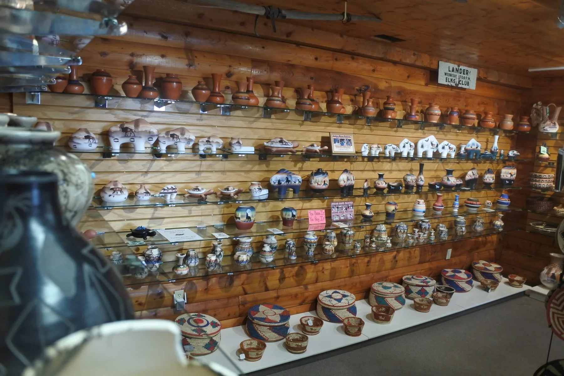 Pottery and baskets displayed inside Wind River Trading Company